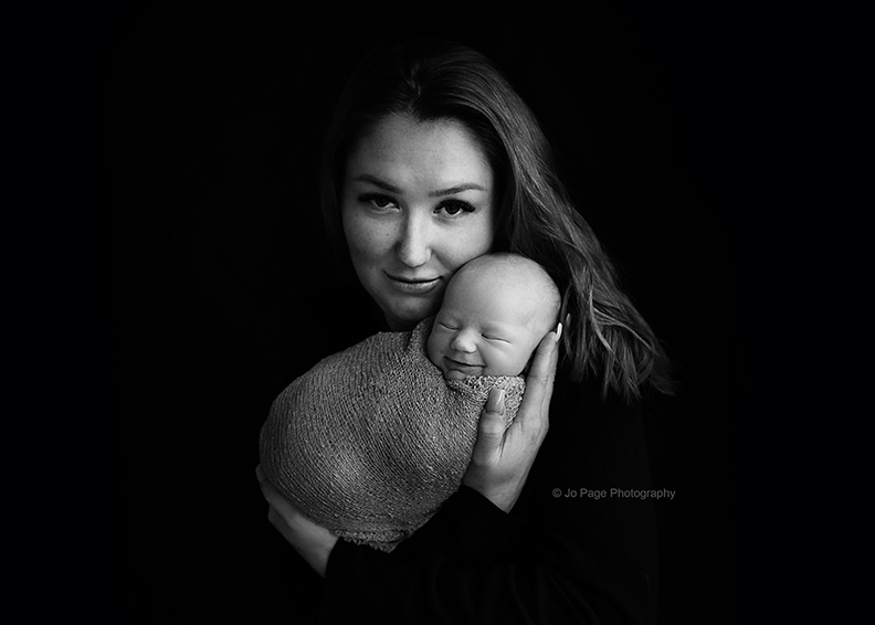 photographer specifying in newborn in sussex capturing mother and baby in black and white image