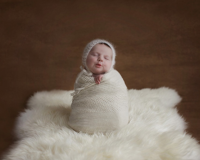 BABY WRAPPED UP NEWBORN BABY IN COMPOSITE IMAGE WITH JO PAGE PHOTOGRAPHY