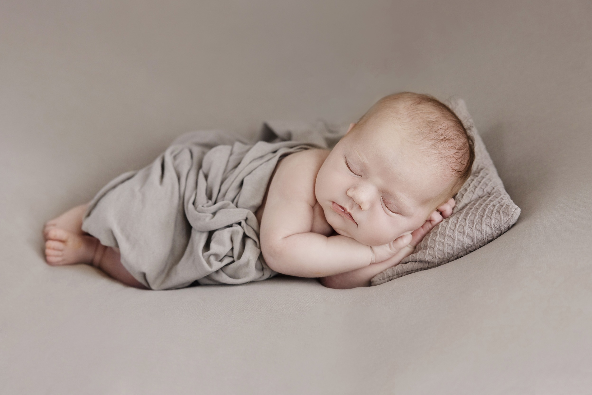 Baby sleeping on bean bag ins studio Uckfield Newborn Photographer